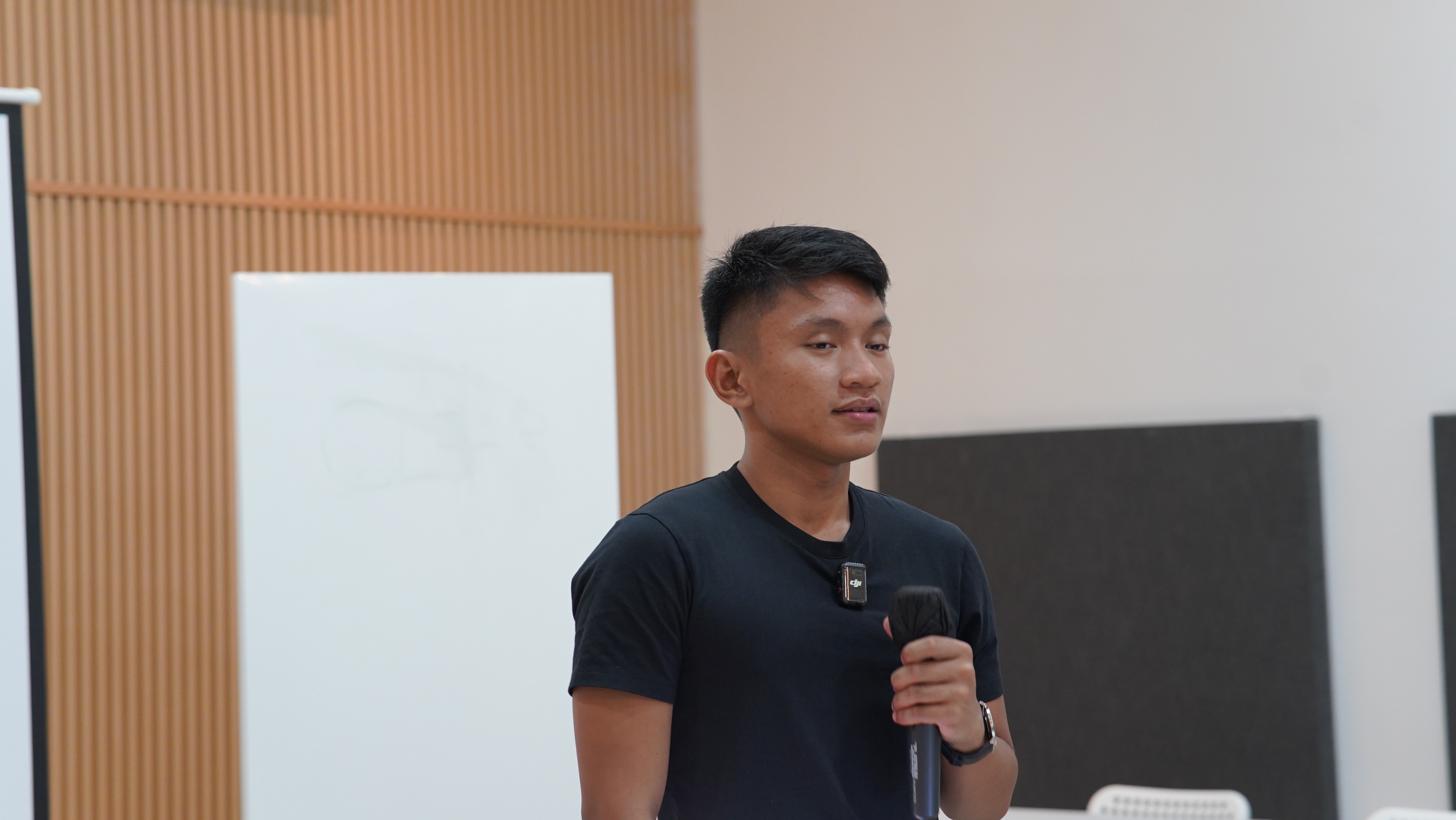 Zeus speaking at a workshop